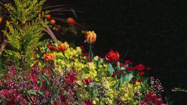 a colorful raised garden bed filled with vegetables and flowers