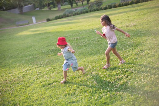 Children playing in a vibrant green park