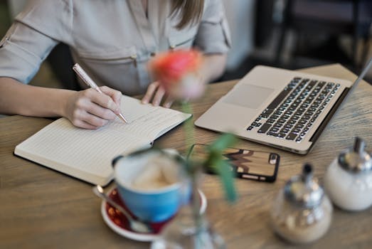 a person writing in a gardening journal